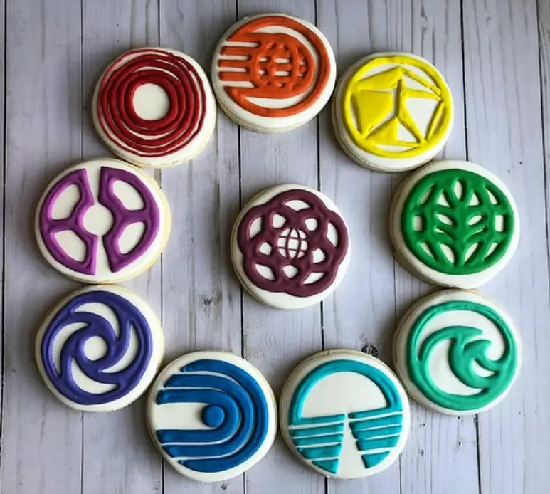 Set of 10 sugar cookies decorated with royal icing, each representing an iconic EPCOT pavilion