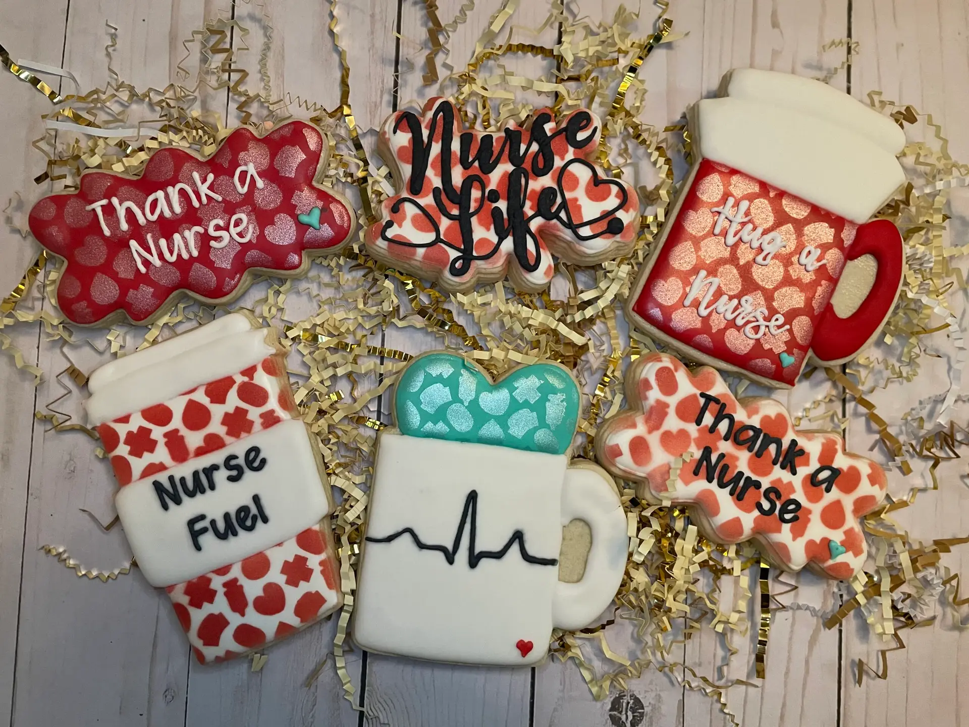 Custom nurse appreciation cookie set with decorated royal icing cookies in red, white, teal, and heart-themed designs